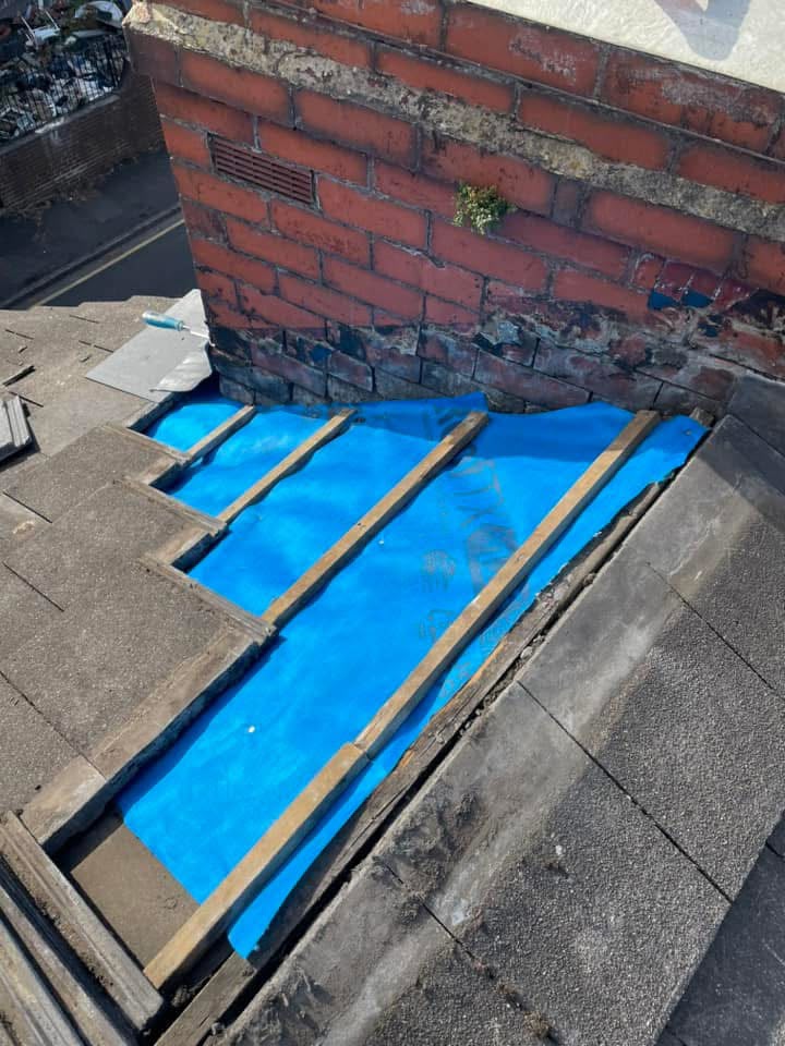 Roof repairs in Glasgow: breathable membrane and battens exposed during a leak repair